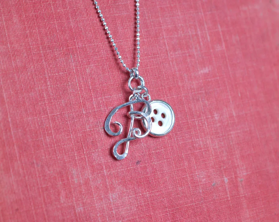 B with button necklace