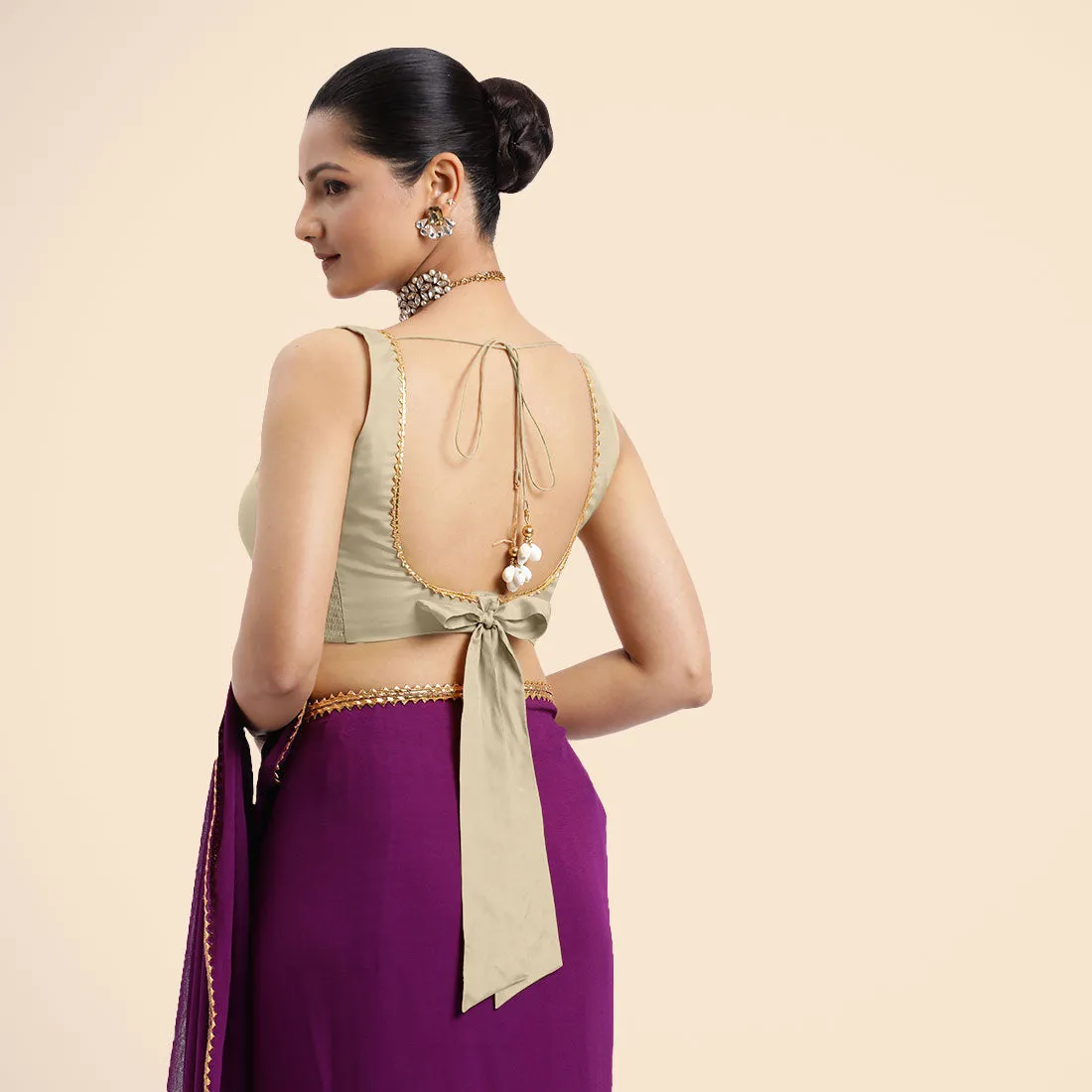 Raisa x Tyohaar | Cream Sleeveless FlexiFit™ Saree Blouse with V Neckline with Golden Gota Lace Embellishment and Back Cut-out with Tie-Up